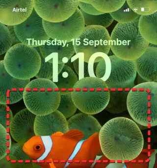 Slik legger du tid bak bakgrunnsbilde i iOS 16