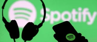 Как да повтаряте песни в Spotify